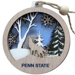 wooden ornament featuring winter scene with howling coyote and Penn State